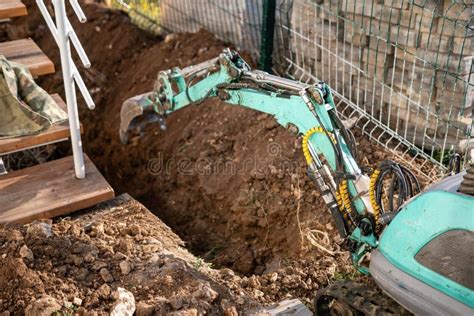 how to dig a trench with a mini excavator|digging through an open trench.